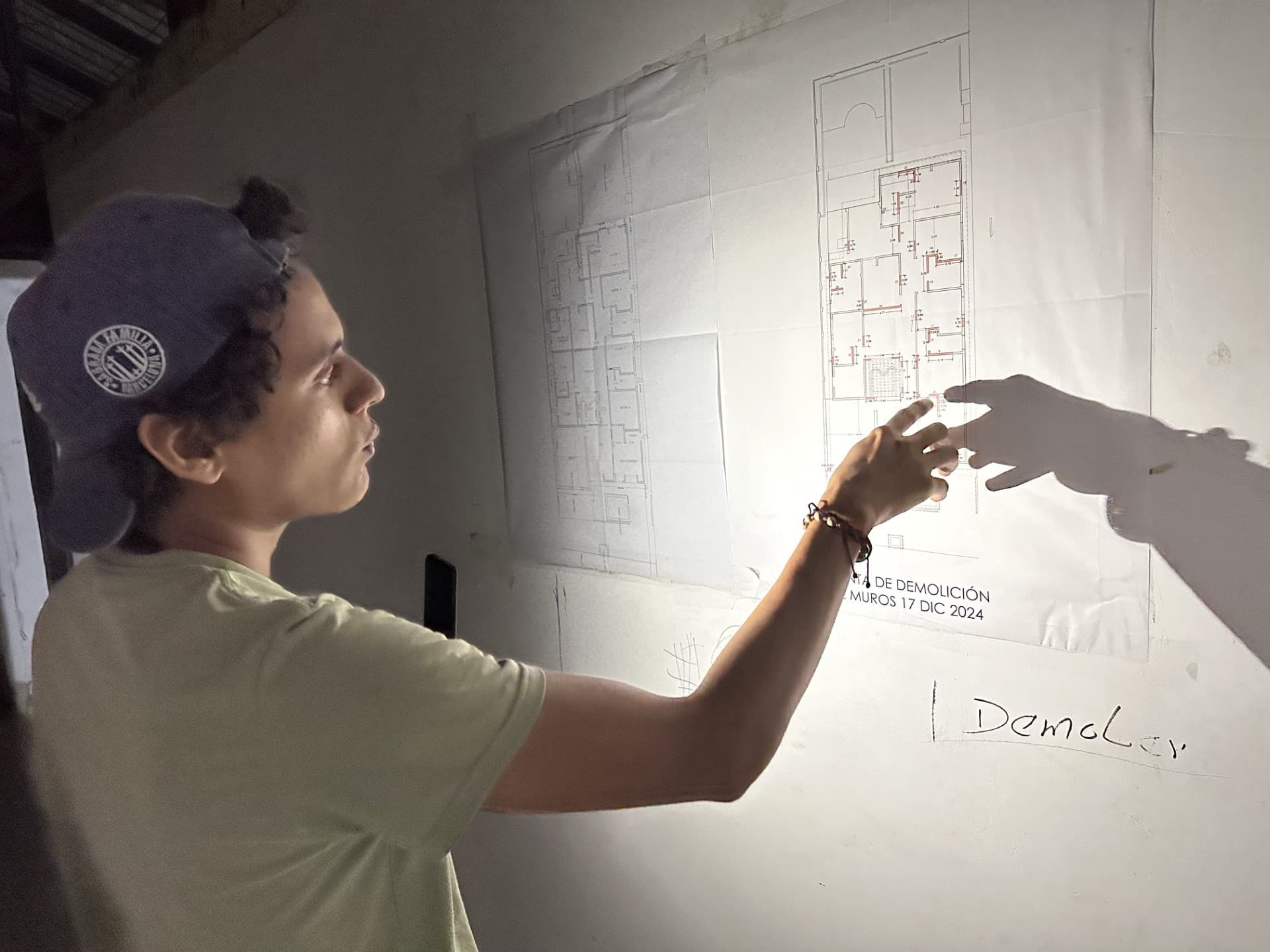 Cristian reviewing the demolition plan