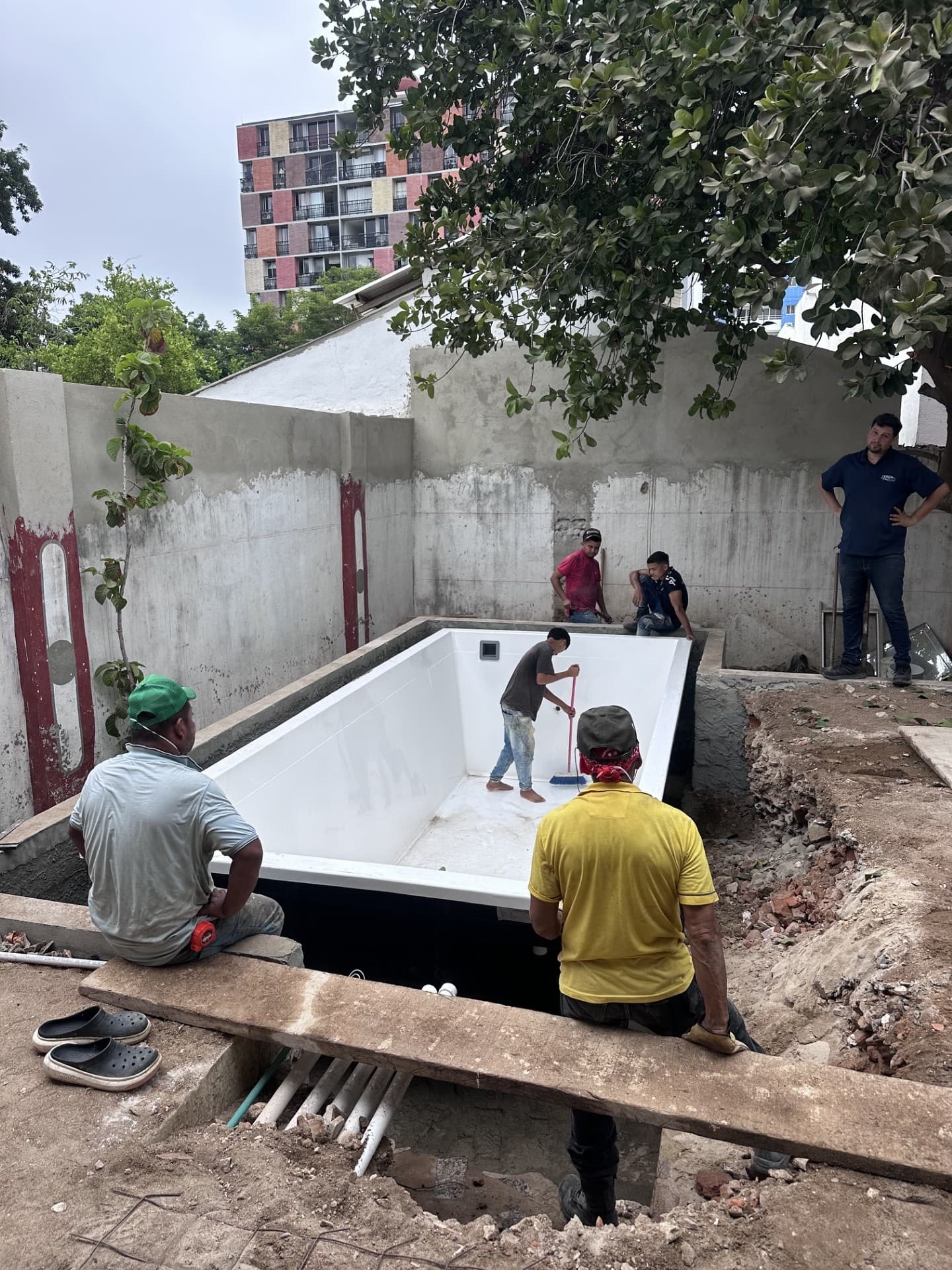 The pool, lifted up and over the roof into place